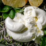 Traditional italian burrata knotted cheese in bowl